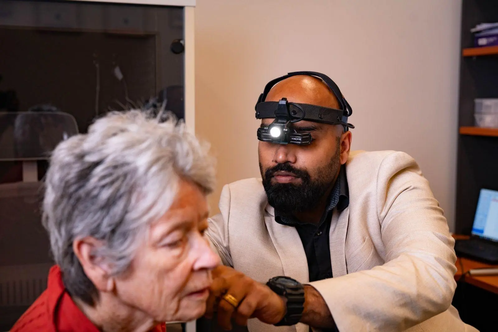 Professional ear wax removal and ear examination by expert audiologist at Welfast Hearing clinic.